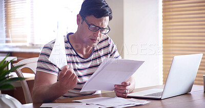 Buy stock photo Man, documents and laptop in home for taxes, finance and writing with info for compliance in morning. Person, contract and reading paperwork for review, budget and invest with computer at apartment