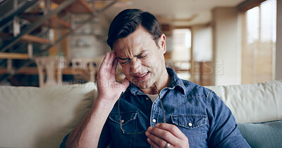 Buy stock photo Man, stress or headache in home with glasses, sickness and medical condition on sofa. Male person, migraine or eye strain in living room for emergency, anxiety or massage temple for relief of illness