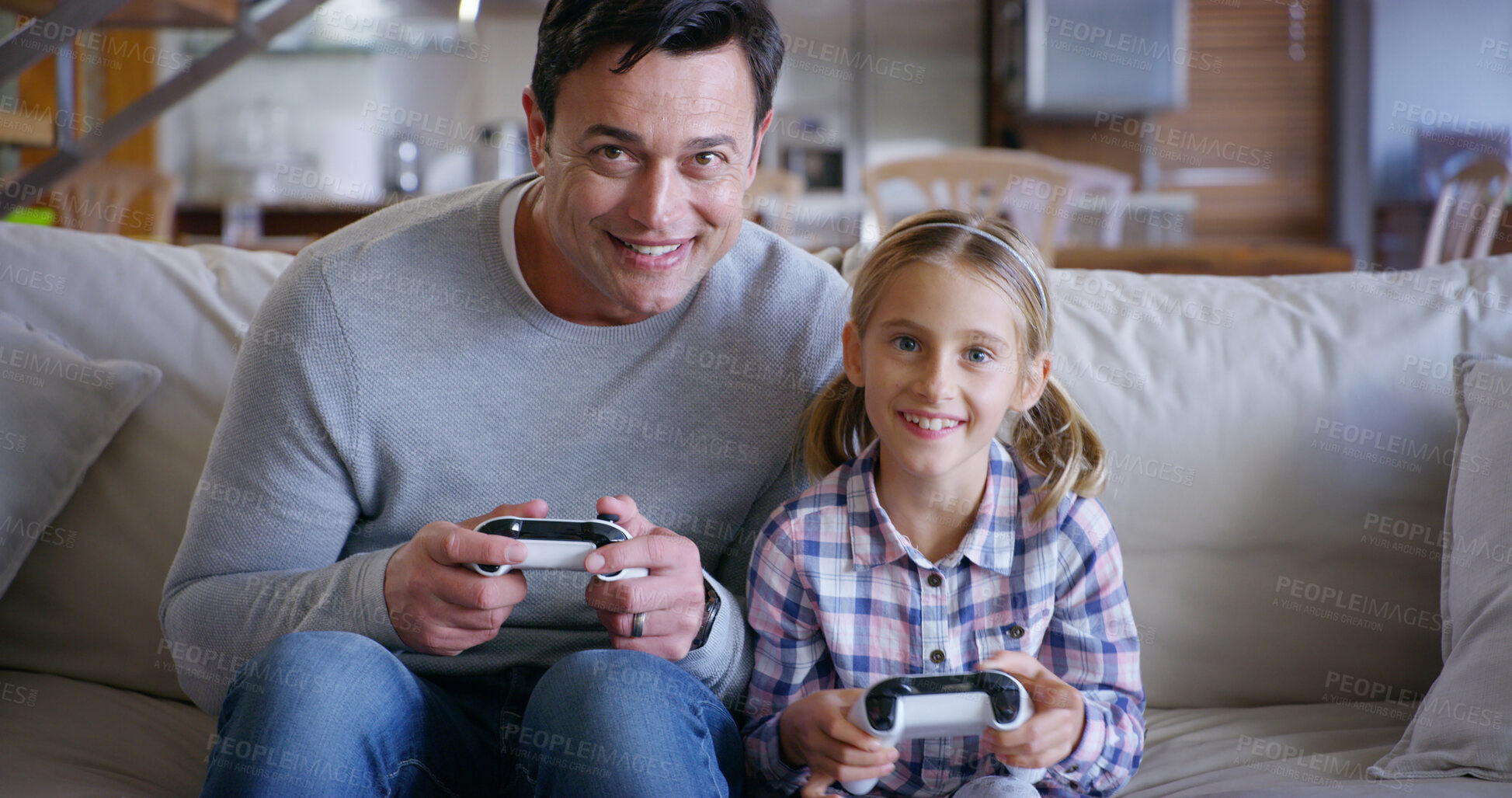 Buy stock photo Playing, dad and child with controller, video game and bonding with tech, fun and competitive in house. Lounge, gamer and man with console, kid and subscription for family, electronics and home