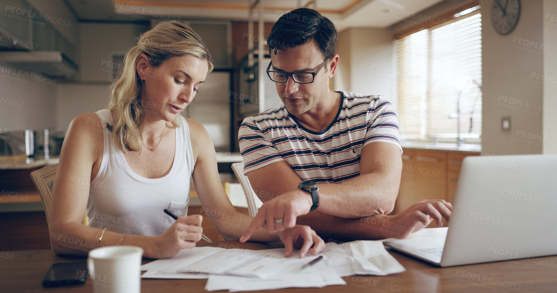 Buy stock photo Woman, man and documents in home for finance, laptop and discussion for tax compliance in morning. Couple, point and reading paperwork for review, budget and investing with computer at apartment