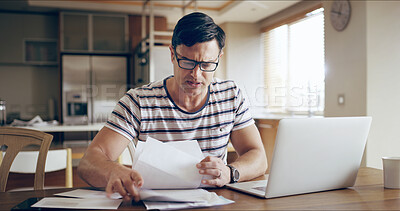 Buy stock photo Man, stress and loan paperwork on laptop in home with working, payment and financial debt. Mortgage, anxiety and invoice check on tech with investment and bankruptcy with inflation and cost planning