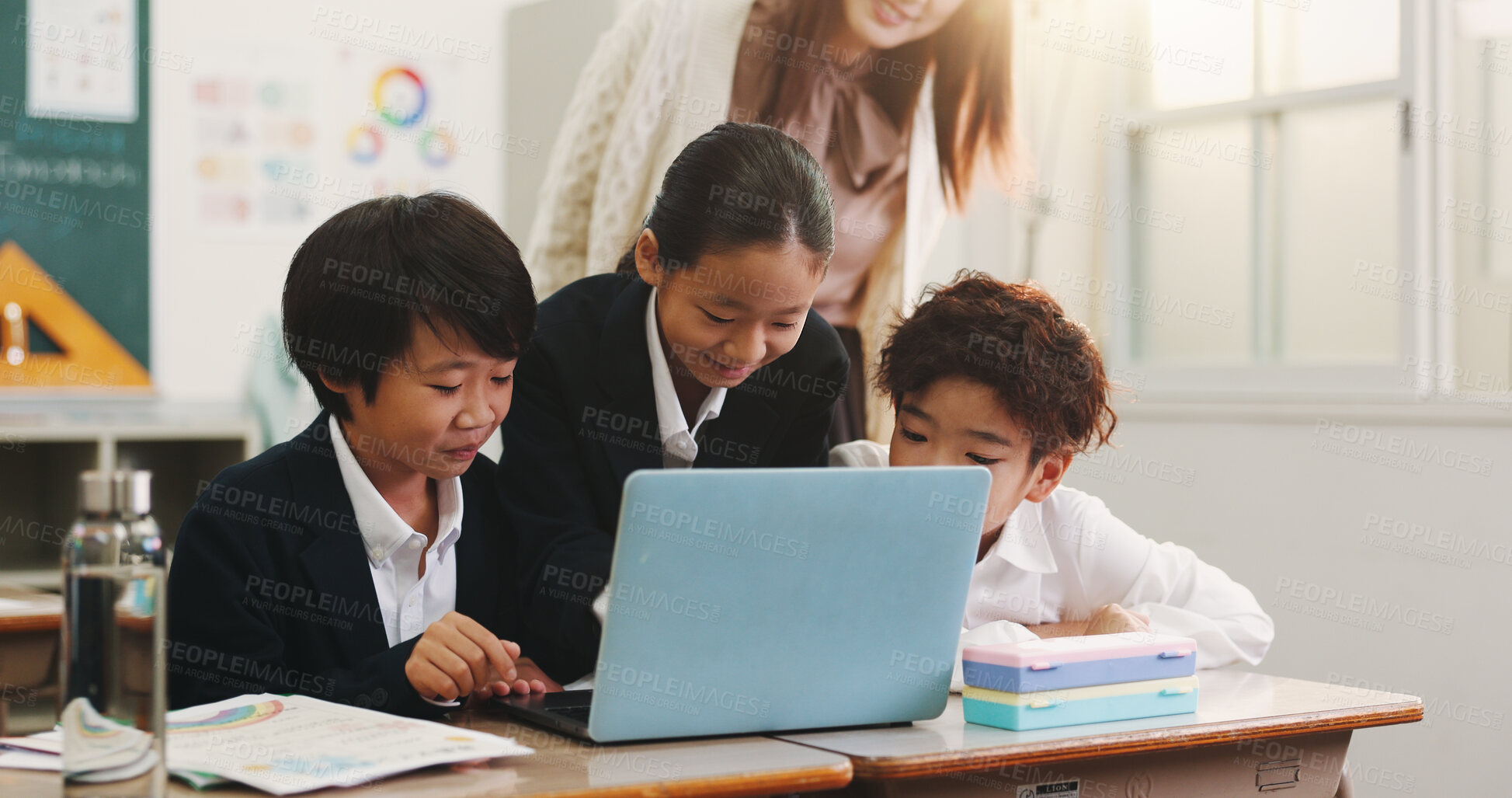 Buy stock photo Children, laptop and teacher in classroom for education, reading and happy with project at academy. People, kids and computer with studying, scholarship and e learning with guide at school in Japan