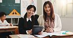 Girl, tablet and teacher in classroom for portrait, education and happy with project at academy. Woman, child and touchscreen for study, scholarship and e learning app with smile at school in Japan