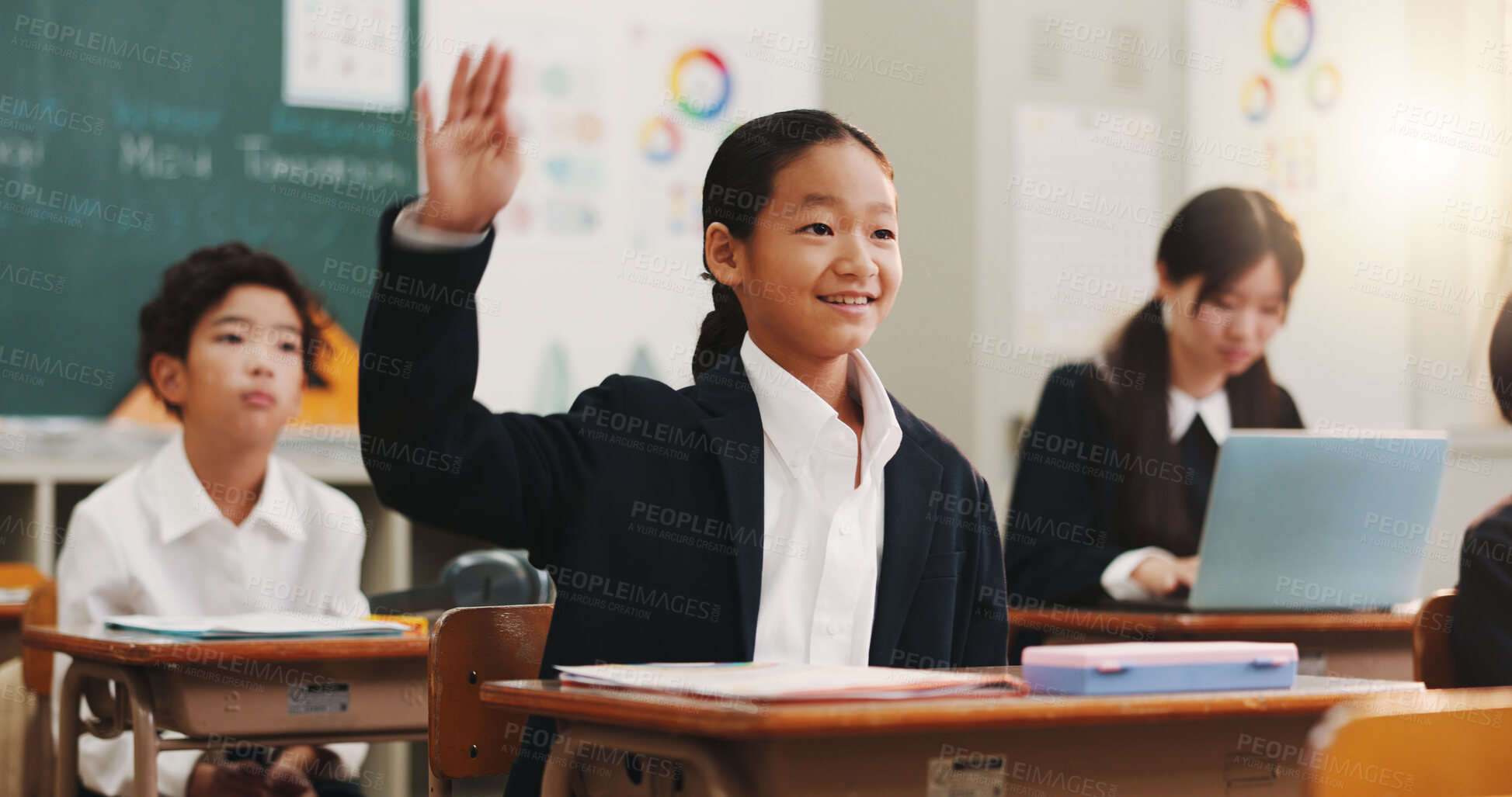 Buy stock photo Boy, raised hand and question in classroom for smile, education or excited for problem solving with knowledge. School kids, learner and sign for answer, solution or happy for quiz at academy in Japan