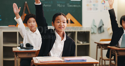 Buy stock photo Boy, raised hand and answer in classroom for learning, opinion and study with problem solving test. School kids, smile and sign for question, solution and progress with quiz at academy in Japan