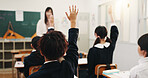 Child, raised hand and back in classroom for learning, question and study with problem solving test. School kids, learner and sign with answer, solution and opinion with quiz at academy in Japan