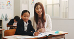 Japanese, teacher and child with portrait in classroom for education support, learning and assessment tuition. Smile, educator and student with writing advice, studying quiz and assistance in Japan 