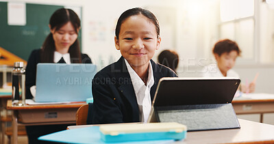 Buy stock photo Boy, tablet and portrait in classroom with smile, education or info on web with research for project. School kids, learner and digital touchscreen for assessment, test and pride at academy in Japan