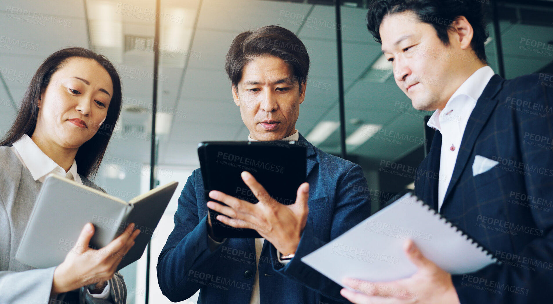 Buy stock photo Reading, planning and colleagues with tablet, office and collaboration for media strategist and online. Meeting, professional and teamwork for campaign, digital and ads for business people and Japan