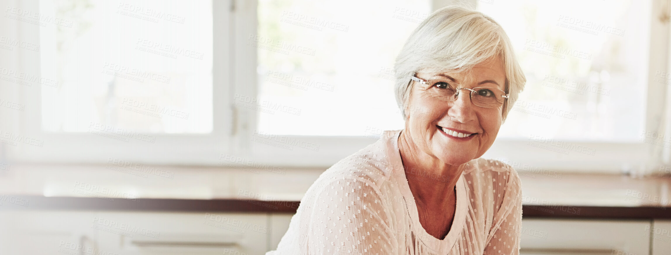 Buy stock photo Senior woman, smile and portrait in home for relax, weekend morning and comfort in kitchen banner. Elderly person, glasses and happy for retirement with self care, peace and space in Australia