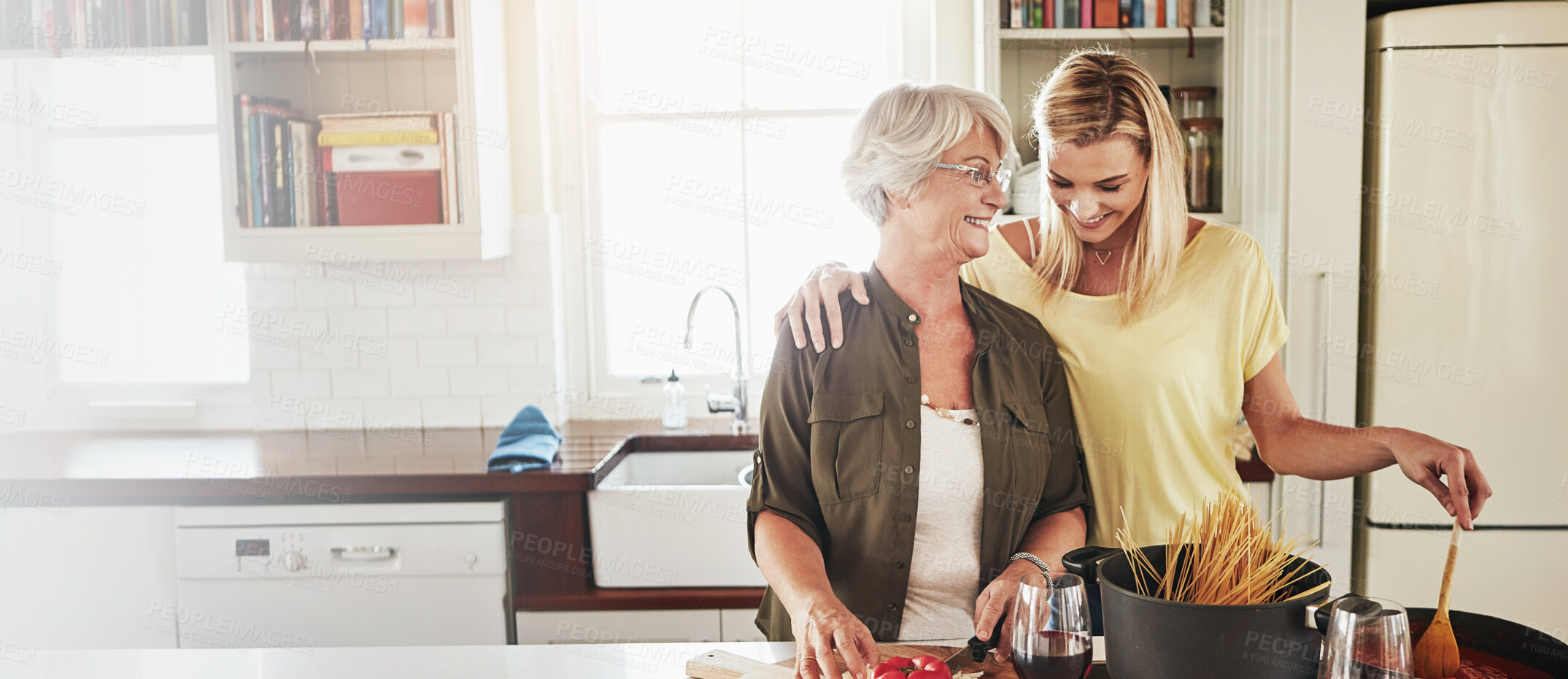 Buy stock photo Mother, adult daughter and cooking in kitchen, hug and bonding together with smile. Mama, banner or embrace in house, ingredients and recipe with skills, happiness and cheerful with joy and spaghetti