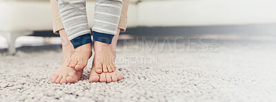 Buy stock photo Walking, parent and feet of baby in home with first steps, mobility support and child development on carpet. Banner, person and kid with balance, trust and learning motor skills for growth on floor