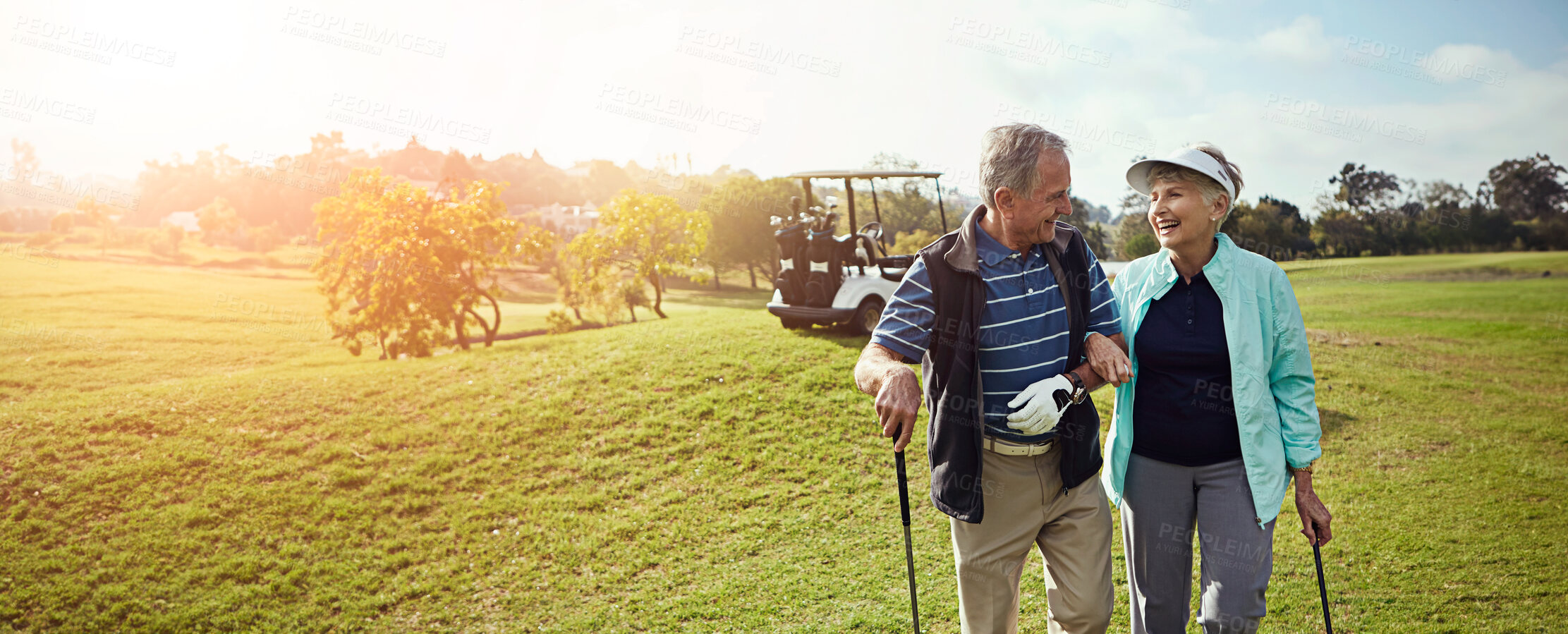 Buy stock photo Golf, outdoor and senior couple on course for sports at country club together for leisure activity. Lensflare, happy and elderly man and woman people playing game in retirement for bonding in nature.