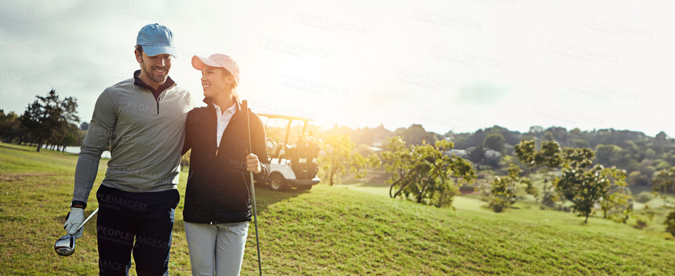 Buy stock photo Golf, happy and couple with hug on field together for leisure, hobby or sports activity. Grass, nature and young man and woman athletes embrace and playing game on course for bonding at country club.