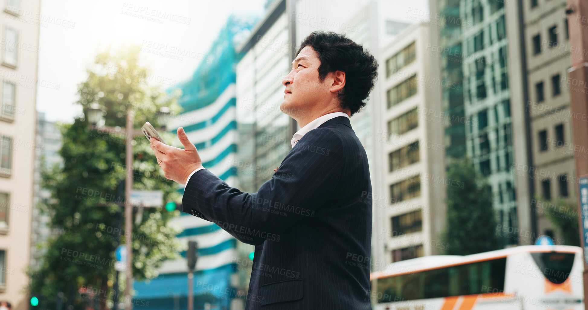 Buy stock photo Outdoor, research and man with smartphone, thinking and real estate agent in city and comparing of prices. Morning, mobile and competition analysis for business, realtor or   Japanese person in Japan