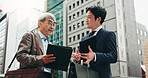 Planning, teamwork and business people in city for documents, development or conversation. Planning, discussion and mature professional Japanese colleagues speaking of urban project together in Tokyo