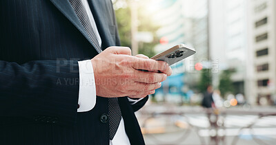 Buy stock photo Phone, hands and businessman in city with typing for email, communication or networking online in morning. Technology, cellphone and closeup of Japanese male lawyer with contact in urban town.