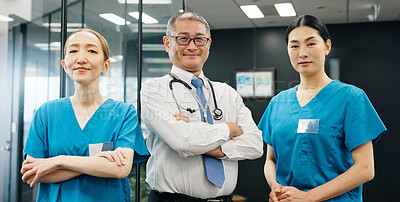 Buy stock photo Asian people, proud or doctors with confidence in hospital for healthcare services and about us. Arms crossed, happy medical professional or nurses with teamwork or smile at wellness clinic in Japan