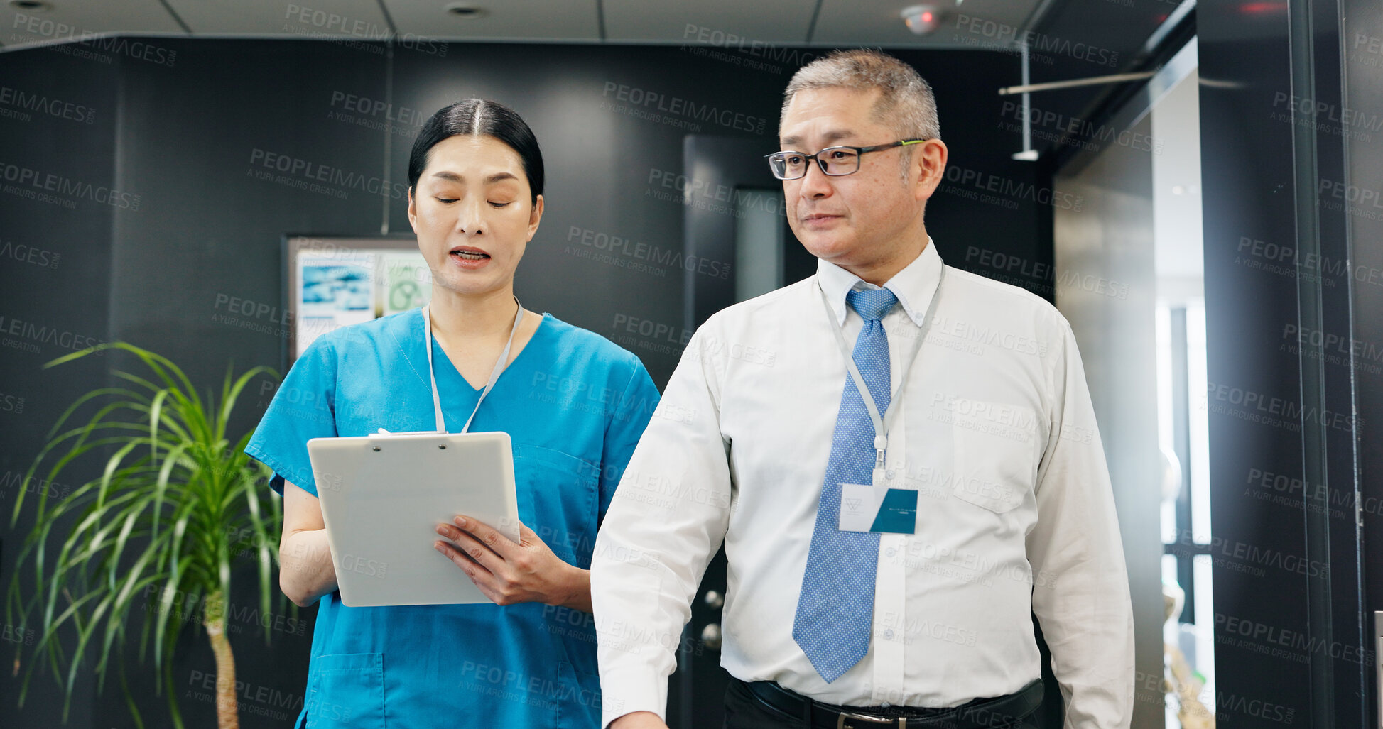 Buy stock photo Doctor, nurse and clipboard for healthcare, planning and medical feedback with collaboration in hospital. Mature man, woman and discussion for health report, teamwork or research with advice in Japan