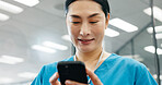 Happy woman, nurse or smile in hospital for news, schedule update or connectivity. Japanese surgeon, phone or mobile in clinic for positive feedback, patient recovery or healthcare email with results