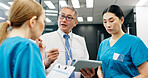 Doctor, nurse and tablet for healthcare, discussion and medical feedback with collaboration in hospital. Mature man, woman and planning for health report, teamwork or research with advice in Japan