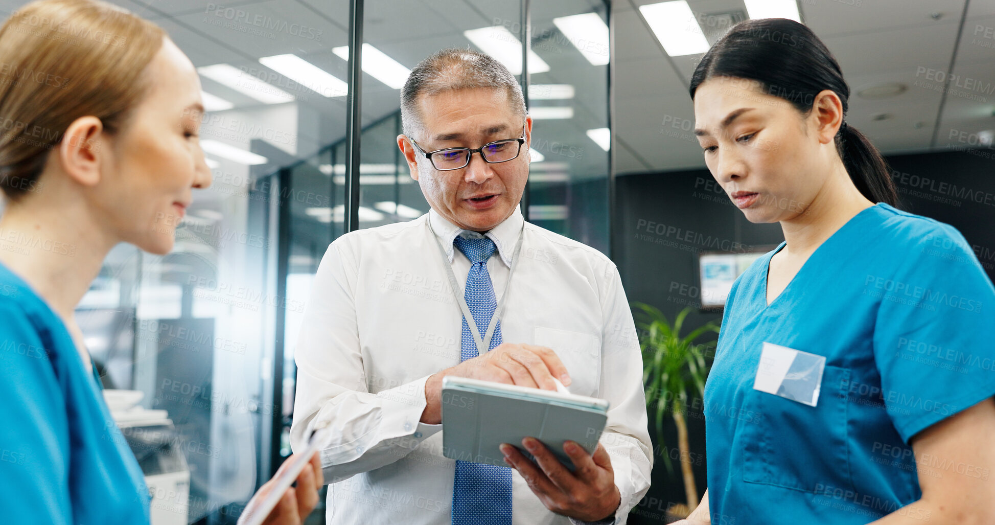 Buy stock photo Doctor, nurses and tablet for healthcare, collaboration or medical feedback with discussion in hospital. Mature man, woman and planning for health report, teamwork or research with advice in Japan