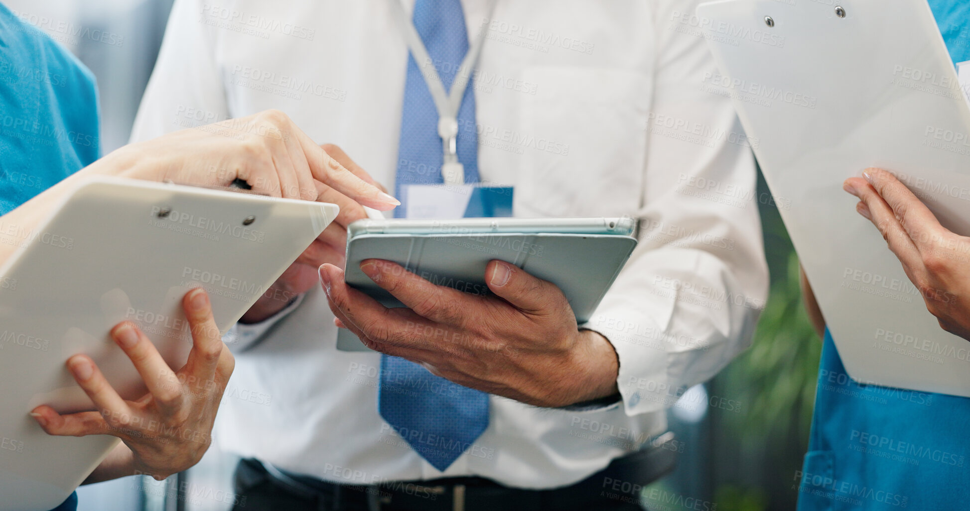 Buy stock photo Doctor, nurses and hands for tablet, healthcare and medical collaboration with discussion in hospital. People, brainstorming and planning for health report, teamwork or research with review in Japan