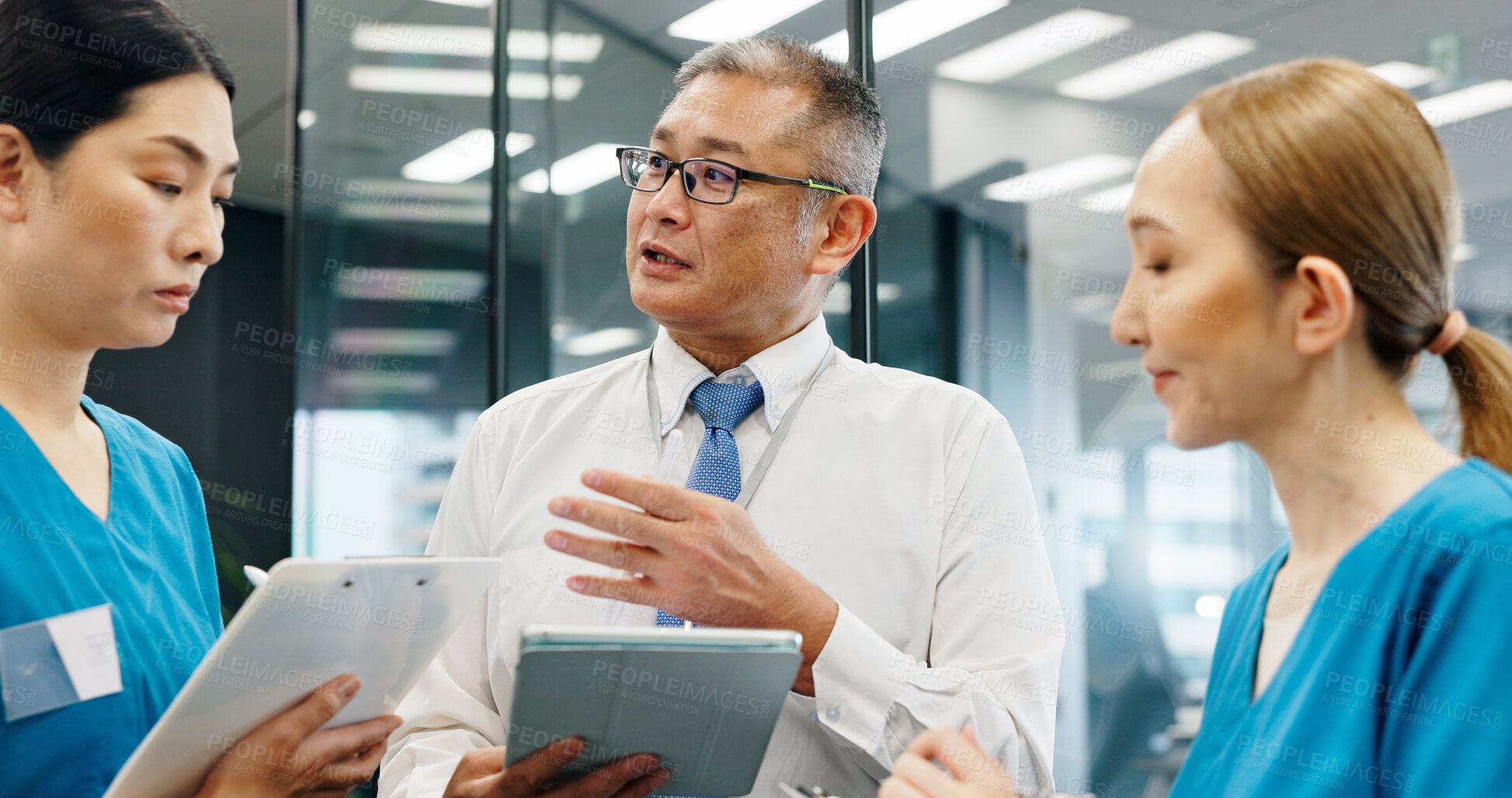 Buy stock photo Doctor, nurse and tablet for healthcare, research and medical feedback with collaboration in hospital. Mature man, woman and planning for health report, teamwork or discussion with advice in Japan