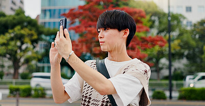 Buy stock photo Photographer, holiday and man with smartphone, city and capture of vacation, travel and tourism. Outdoor, influencer and photography for content creation, trip and pictures for social media in Japan