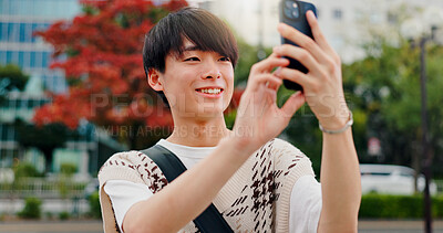 Buy stock photo Photography, trip and man with smartphone, city and capture of vacation, content creation and memory. Outdoor, influencer and tourism for vlog, travel and pictures for social media, smile and Japan