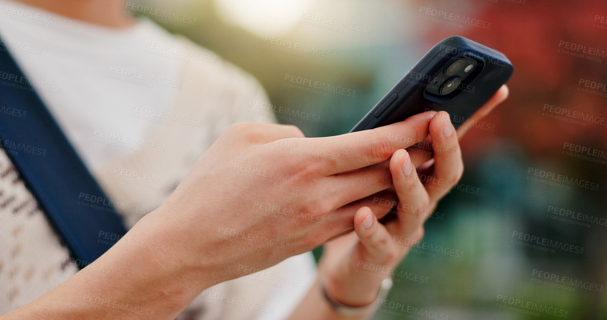 Buy stock photo Phone, hands and student in city for email typing for communication, networking or contact. Closeup, cellphone and person with mobile app for university test results online outdoor in town in Japan.