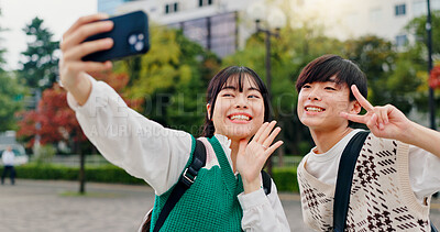 Buy stock photo Couple, selfie or peace sign in city for social media, healthy relationship or fun with memory in Tokyo. Japanese people, influencers or happy in park for photography, content creation or live stream