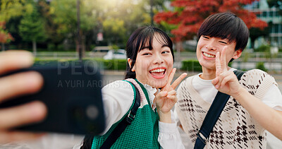 Buy stock photo Happy couple, selfie and peace sign in park for social media, relationship or update status in Osaka. Japanese people, influencers and outdoor in city for photography, content creation or live stream