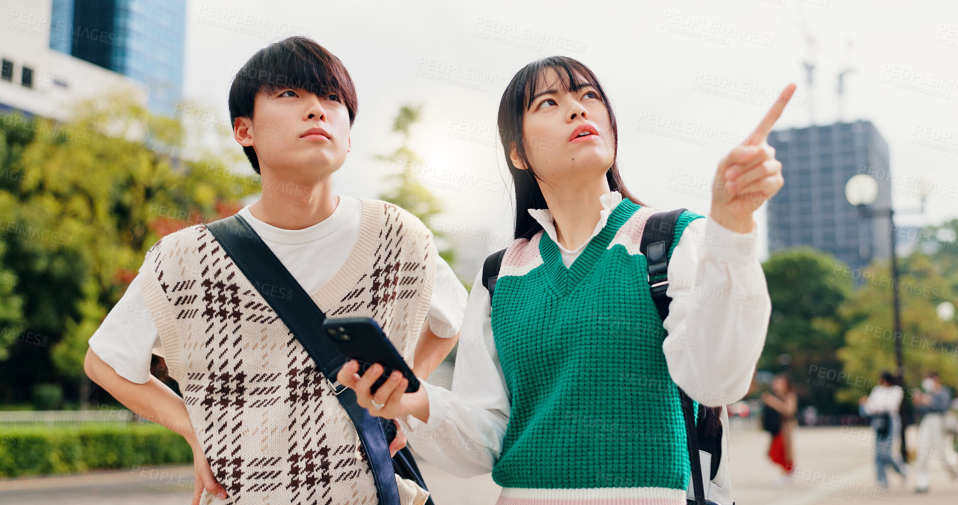 Buy stock photo Travel, pointing and couple in city with phone, outdoor morning adventure and online search for location. Smartphone, Japanese man and woman on urban sightseeing trip with mobile app for digital map