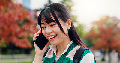 Buy stock photo Japan, phone call and outdoor with woman, smile and communication with contact. Happy, person and student with smartphone, mobile user and technology with digital app, commute and joyful in park