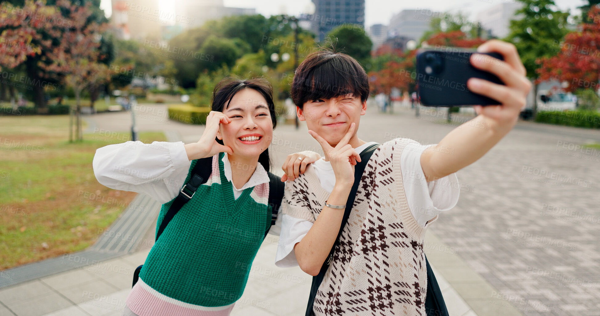 Buy stock photo Happy man, woman and selfie in city for social media, live stream and follower interaction in Kyoto. Japanese people, influencer couple and gesture in park for photography, video and content creation