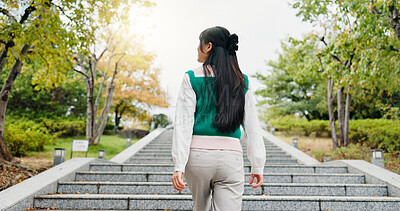 Buy stock photo Japanese, woman and walking for travel outdoor with sightseeing view, morning commute and vacation journey. Back, girl and steps for thinking, holiday adventure and nature scenery of tourism in Japan