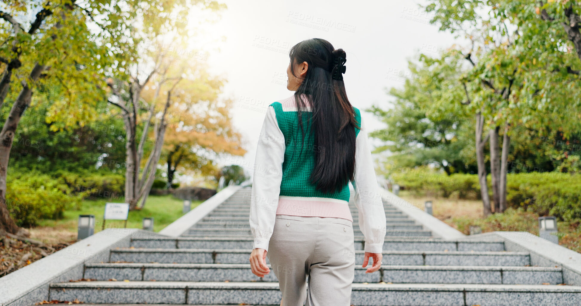 Buy stock photo Japanese, woman and walking for travel outdoor with sightseeing view, morning commute and vacation journey. Back, girl and steps for thinking, holiday adventure and nature scenery of tourism in Japan