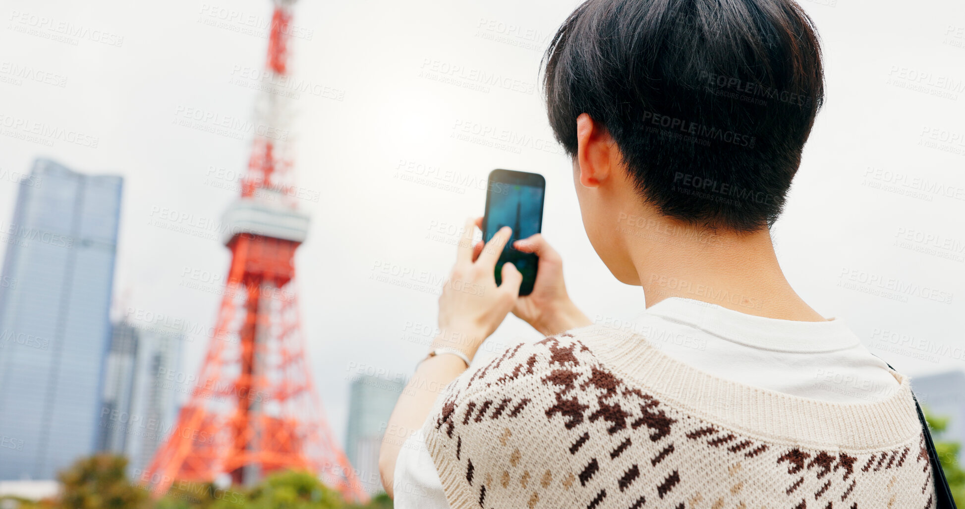 Buy stock photo Tourism, photography and person with smartphone, city and capture of landmark, screen and content creation. Outdoor, influencer and tourist with mobile, display and picture of Tokyo Tower in Japan