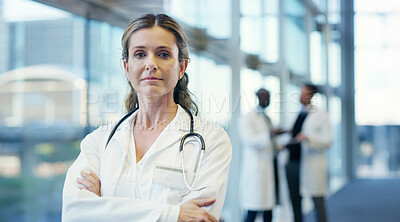 Buy stock photo Woman, doctor and portrait with confidence for medical service, healthcare career or job at hospital. Female person, health professional or cardiologist with stethoscope or arms crossed at clinic