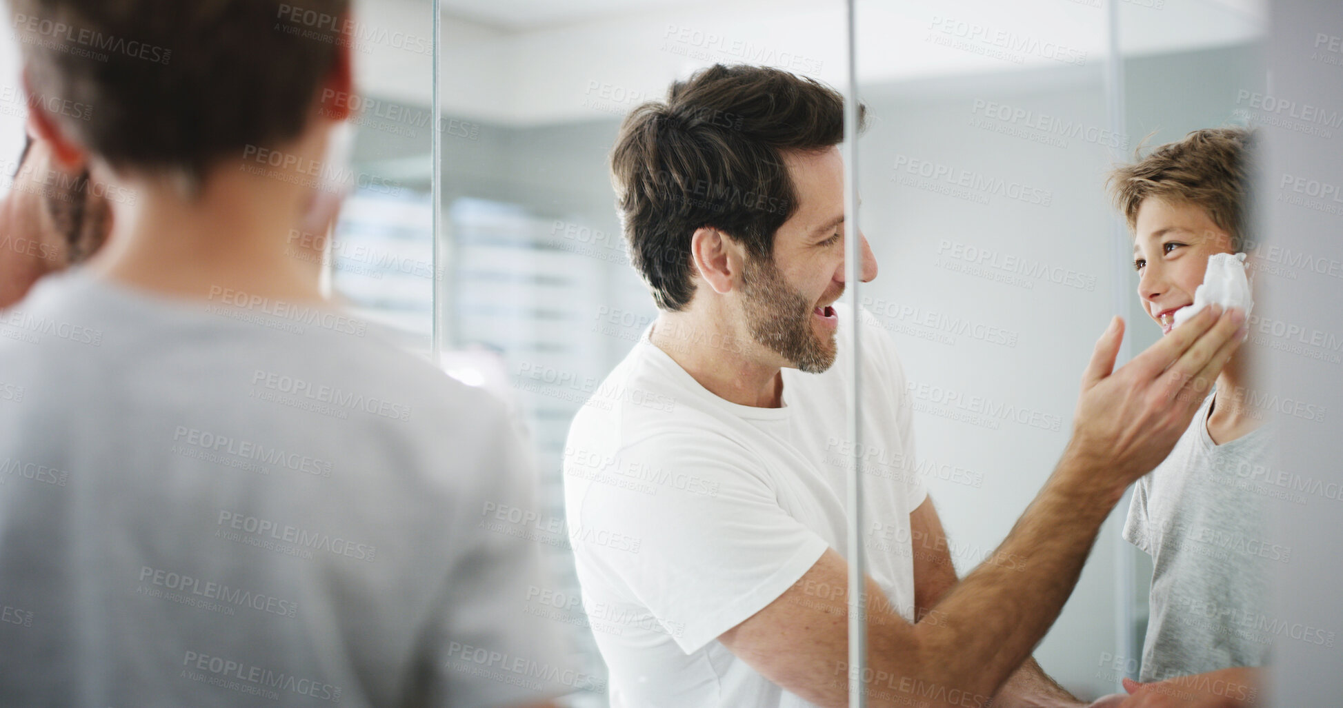 Buy stock photo Shaving cream, father and son in bathroom, mirror and playful with morning routine. Family, parent and dad with boy, house and skincare with grooming, learning and treatment with foam and teaching