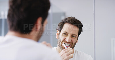 Buy stock photo Mirror, bathroom and man brushing teeth for dental health, wellness and morning routine. Oral care, toothpaste and male person with treatment for gum disease, cavity or plaque prevention in home