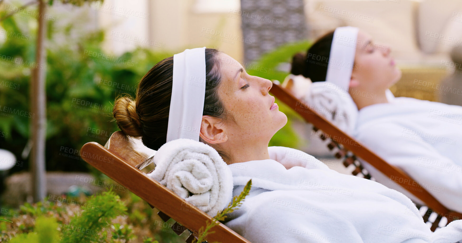 Buy stock photo Resort, woman and relax in robe by spa for weekend break, stress relief or luxury treatment outdoor. Friends, person and resting at beauty lodge for wellness, comfort and self care on holiday getaway