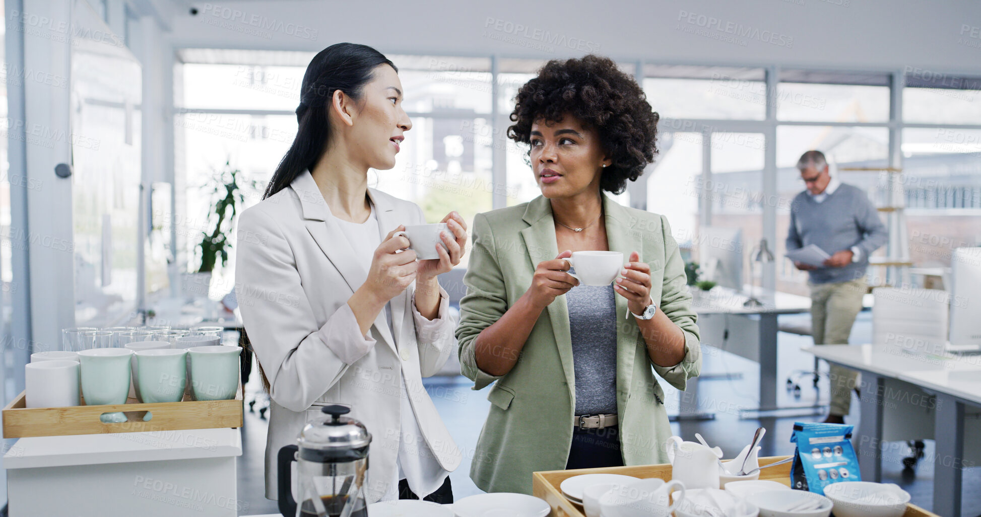 Buy stock photo Business women, coffee break and office with talk, gossip and teamwork in conversation as colleagues. Female people, chat and drinking tea at lunch in kitchen, accounting firm or company for beverage