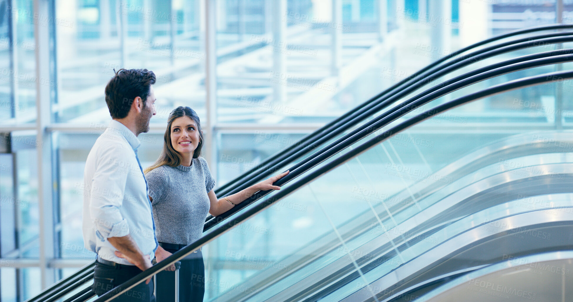 Buy stock photo Business people, escalator and travel at airport with luggage for flight, international journey and chat. Team trip, happy workers and suitcase at lobby for arrival, immigration and brokers talking