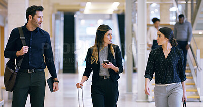 Buy stock photo Business people, talk and walking with luggage for travel, work trip and partnership in airport lobby. Employees, friends and suitcase for international opportunity, journey and project collaboration