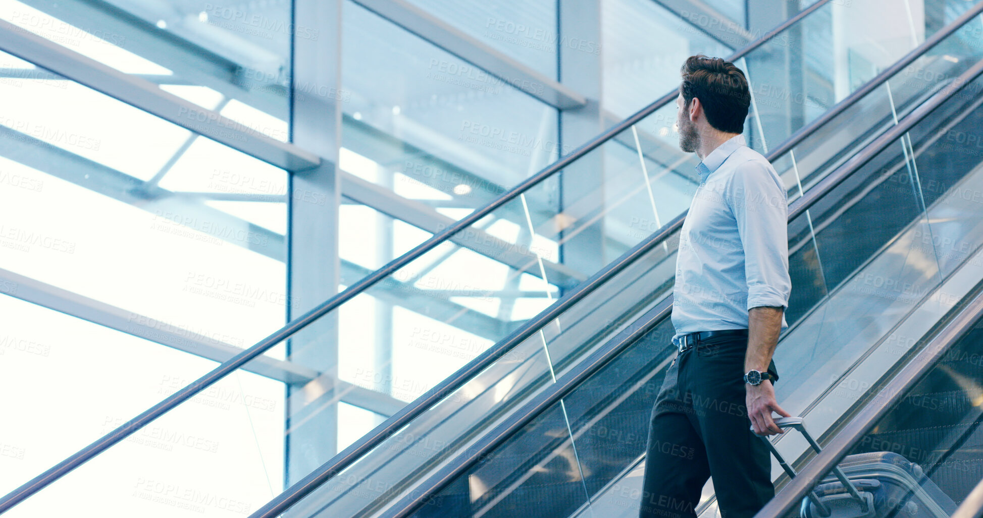 Buy stock photo Businessman, escalator and travel at airport with luggage for flight, journey and thinking. Professional trip, worker and suitcase at lobby for arrival, immigration or airline broker with reflection