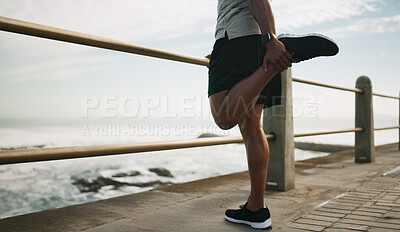 Buy stock photo Man, running and warm up legs at beach, stretching and outdoor nature for fitness. Male person, sea promenade and footwear for exercise preparation, getting ready and cardio workout by ocean waves