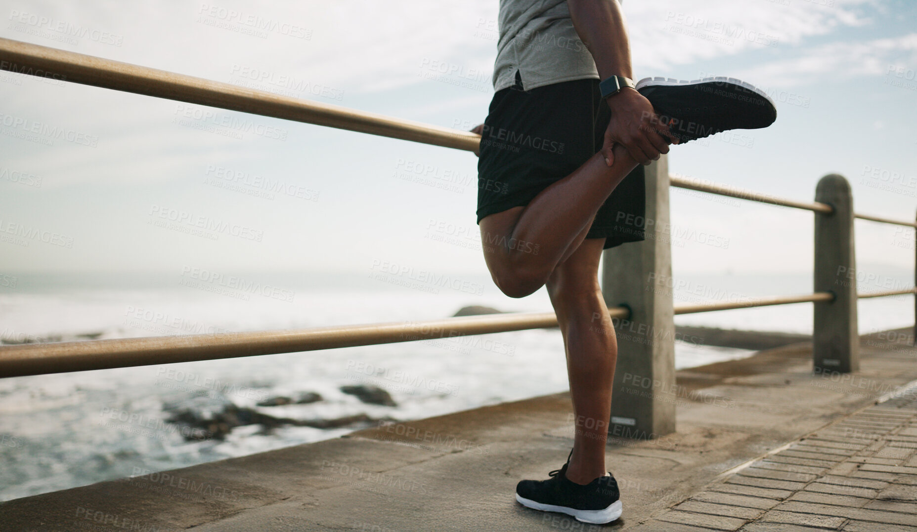 Buy stock photo Man, running and warm up legs at beach, stretching and outdoor nature for fitness. Male person, sea promenade and footwear for exercise preparation, getting ready and cardio workout by ocean waves