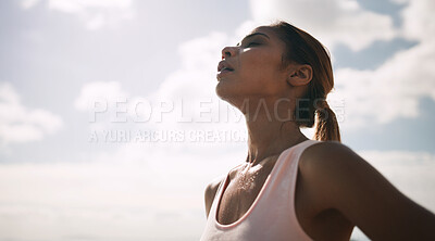 Buy stock photo Outdoor, woman and running break with sweat or breathe for fitness, health and self care. Female person, sky and tired or exhausted with jogging as workout, training and exercise for wellness